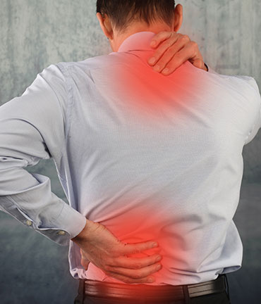 Man suffering lower and upper back pain  after an auto accident